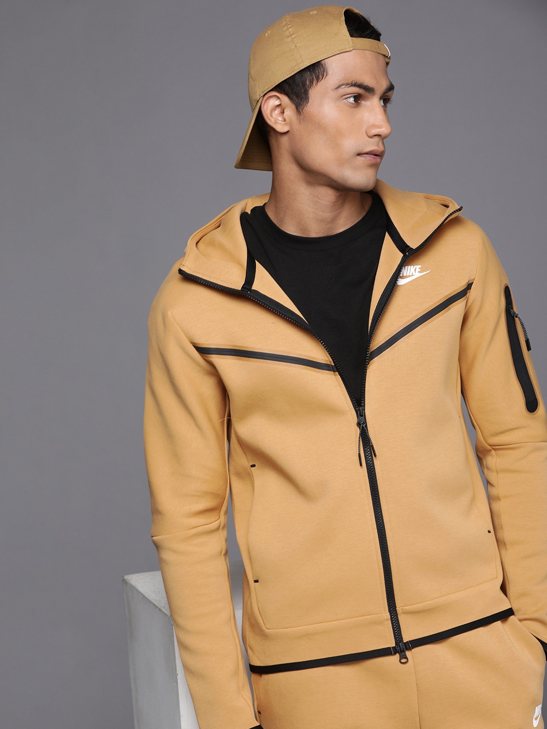 

Nike Men Beige Yellow Sporty Solid Hooded Jacket