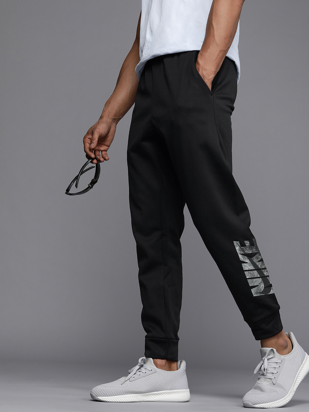 

Nike Therma-FIT Men's Black Tapered Swoosh Graphic Typography Print Fitness Joggers Pants