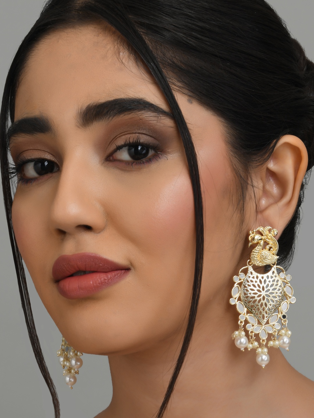

Fida White & Gold Plated Peacock Shaped Kundan Pearl Drop Earrings