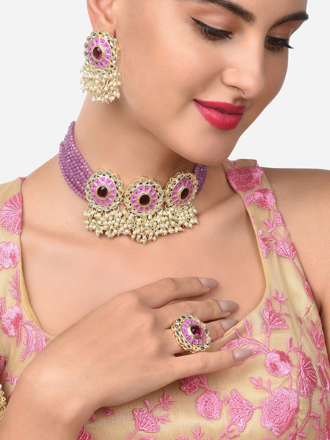 

Zaveri Pearls Gold-Plated Purple & White Crystals Studded & Beaded Jewellery Set