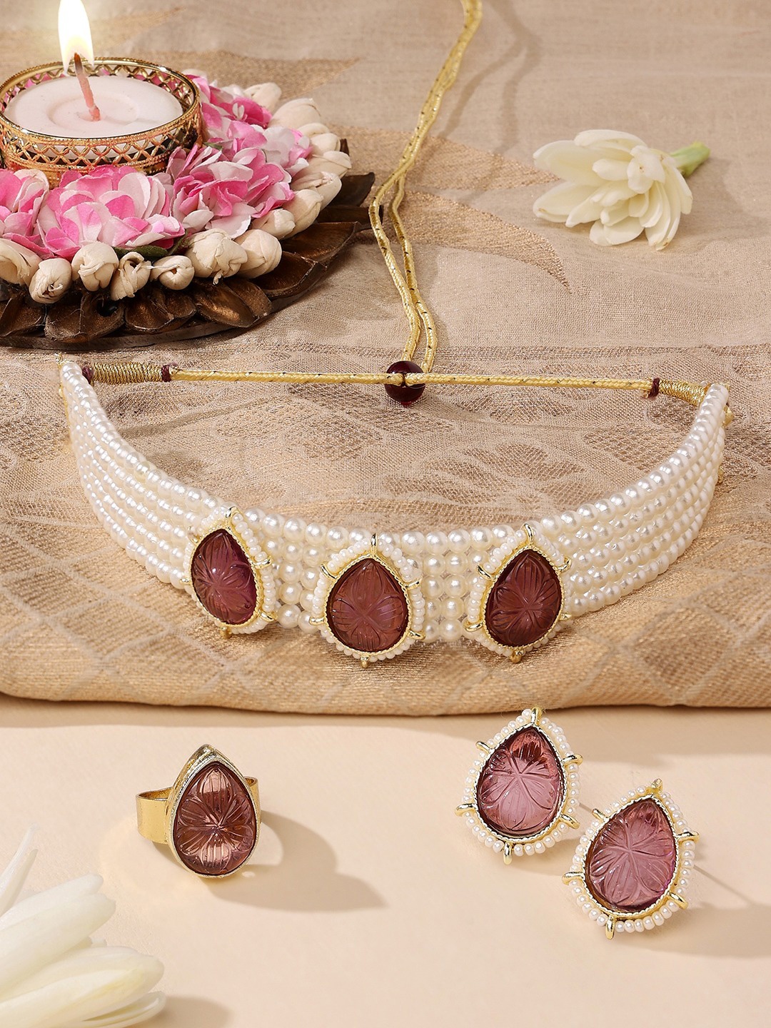 

Zaveri Pearls Gold-Plated Purple & White Stone Studded & Pearls Beaded Jewellery Set