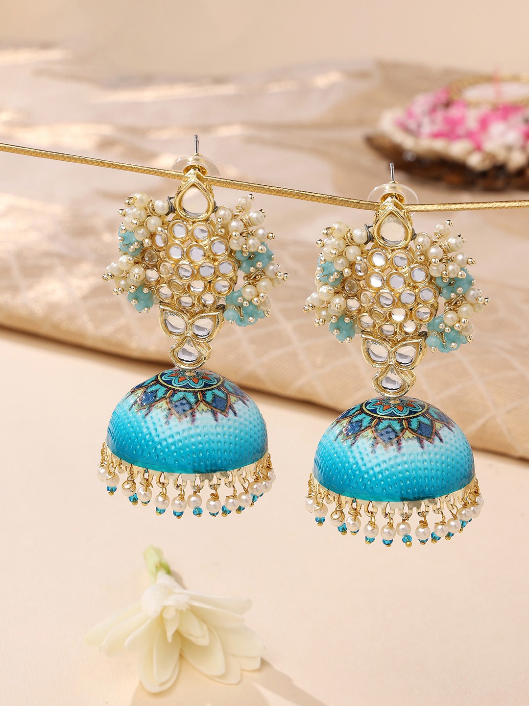 

Zaveri Pearls Women Blue & Gold-Toned Contemporary Jhumkas Earrings