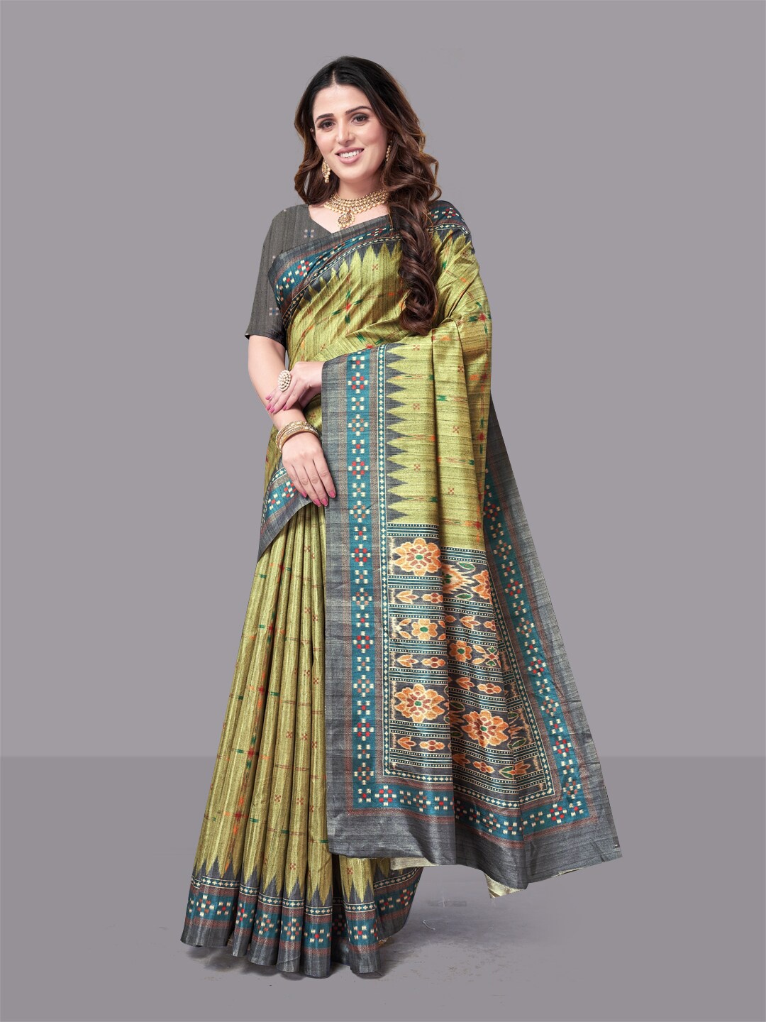 

HERE&NOW Gold Toned And Green Ethnic Motifs Ikat Saree