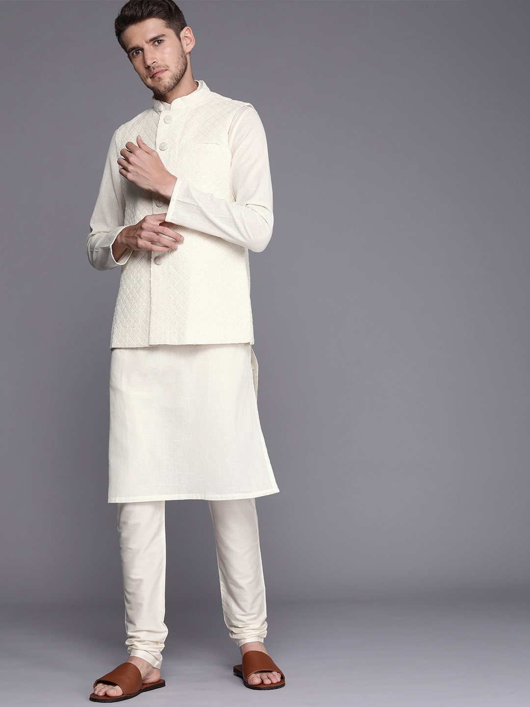 

Manyavar Men Solid Kurta with Pyjamas Comes with a Nehru Jacket, Off white