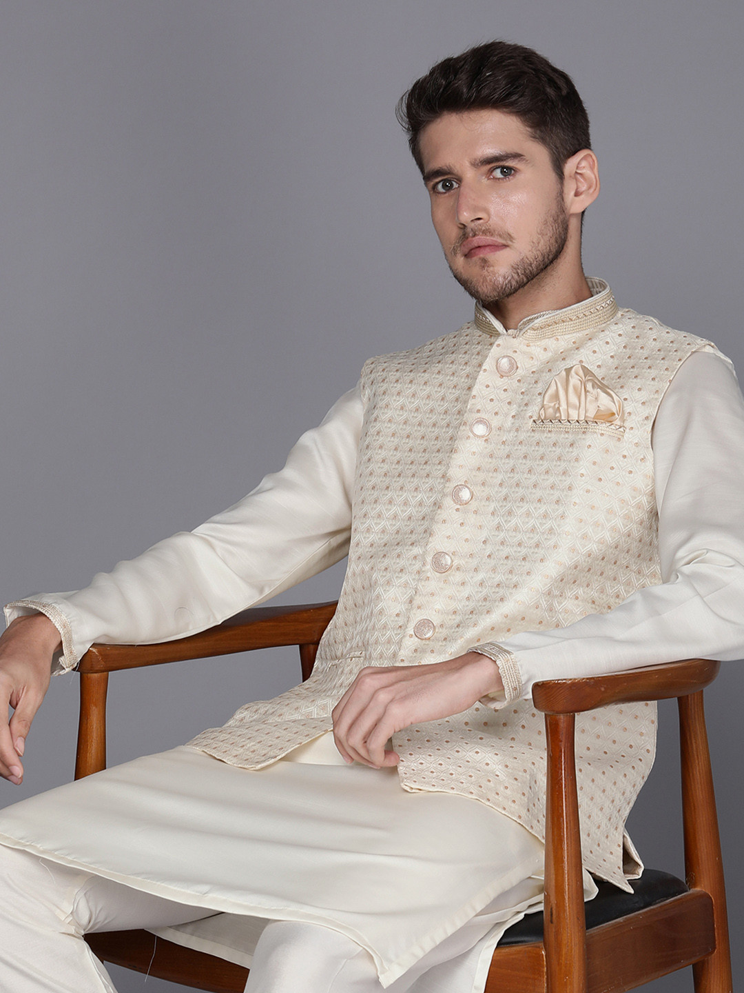 

Manyavar Men Solid Kurta with Pyjamas Comes with a Nehru Jacket, Cream