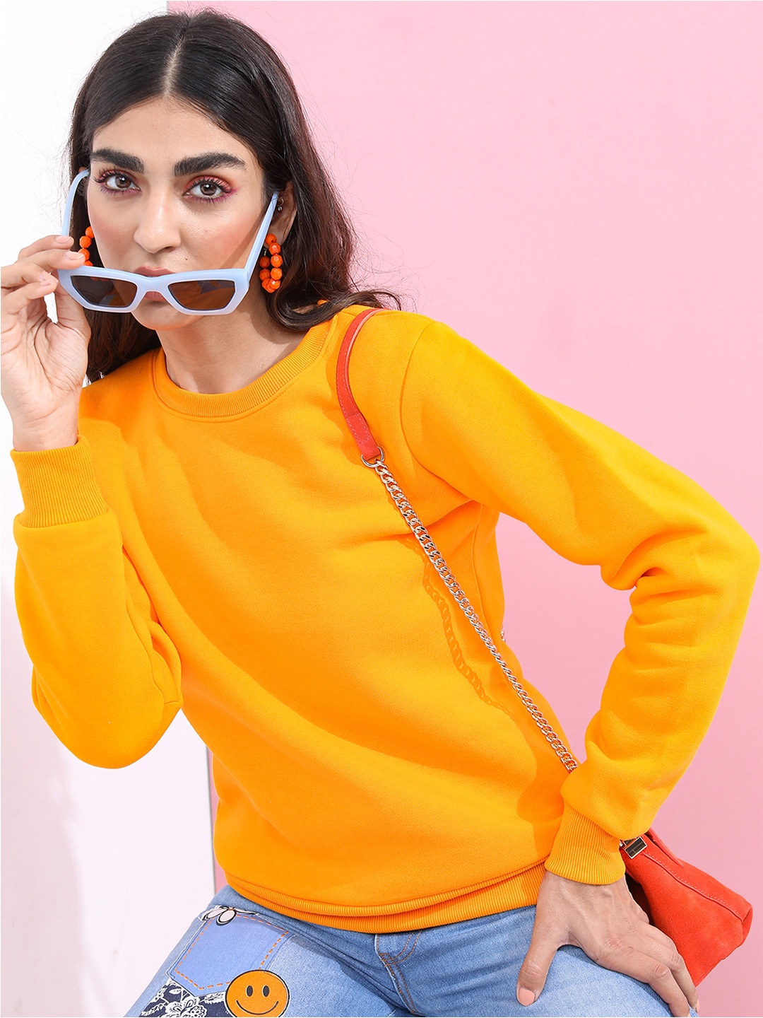 

Tokyo Talkies Women Orange Solid Pullover Sweatshirt