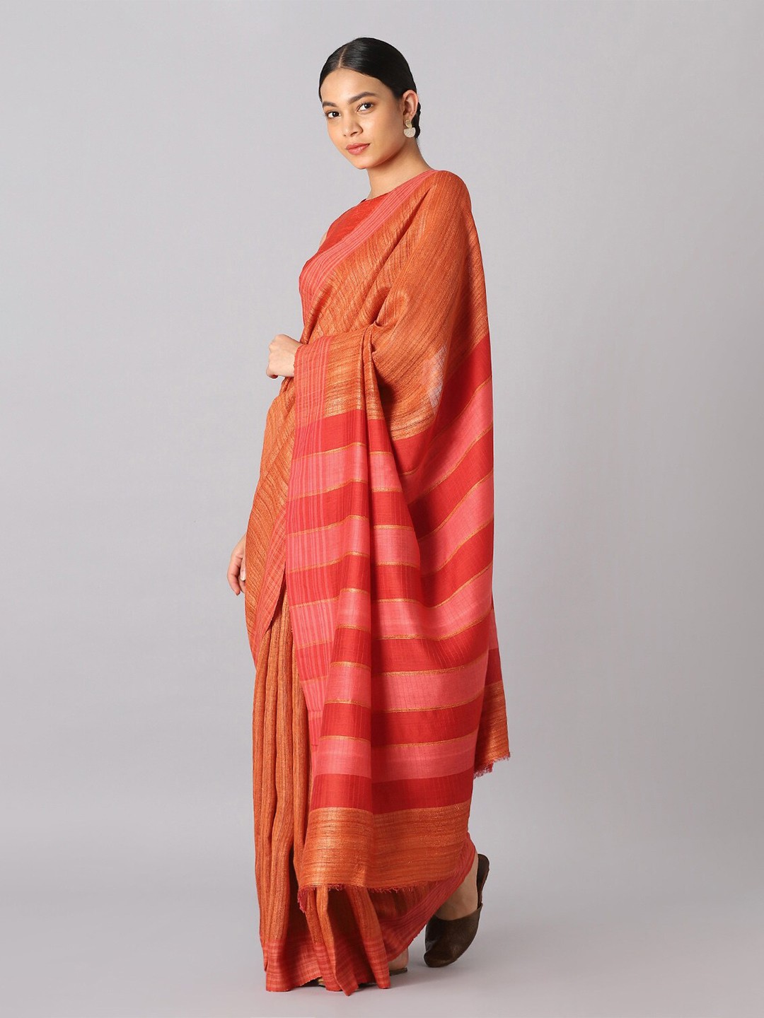 

Taneira Orange And Gold Toned Striped Zari Pure Silk Bhagalpuri Saree
