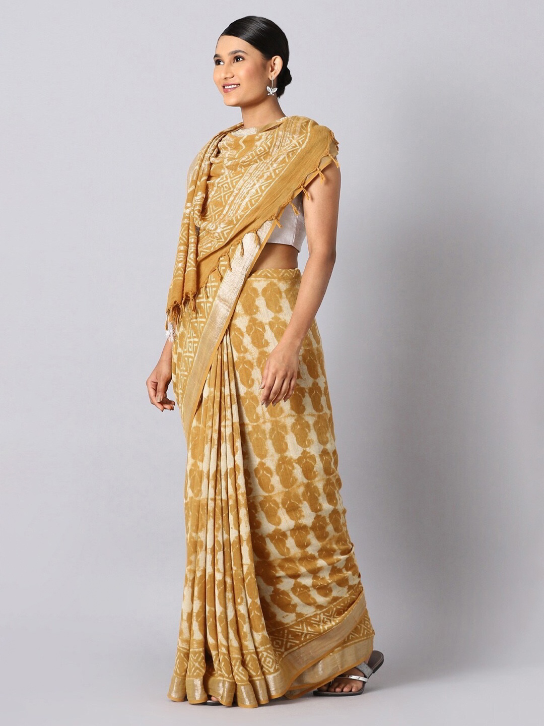 

Taneira Yellow & Gold-Toned Ethnic Motifs Zari Linen Blend Bagru Saree