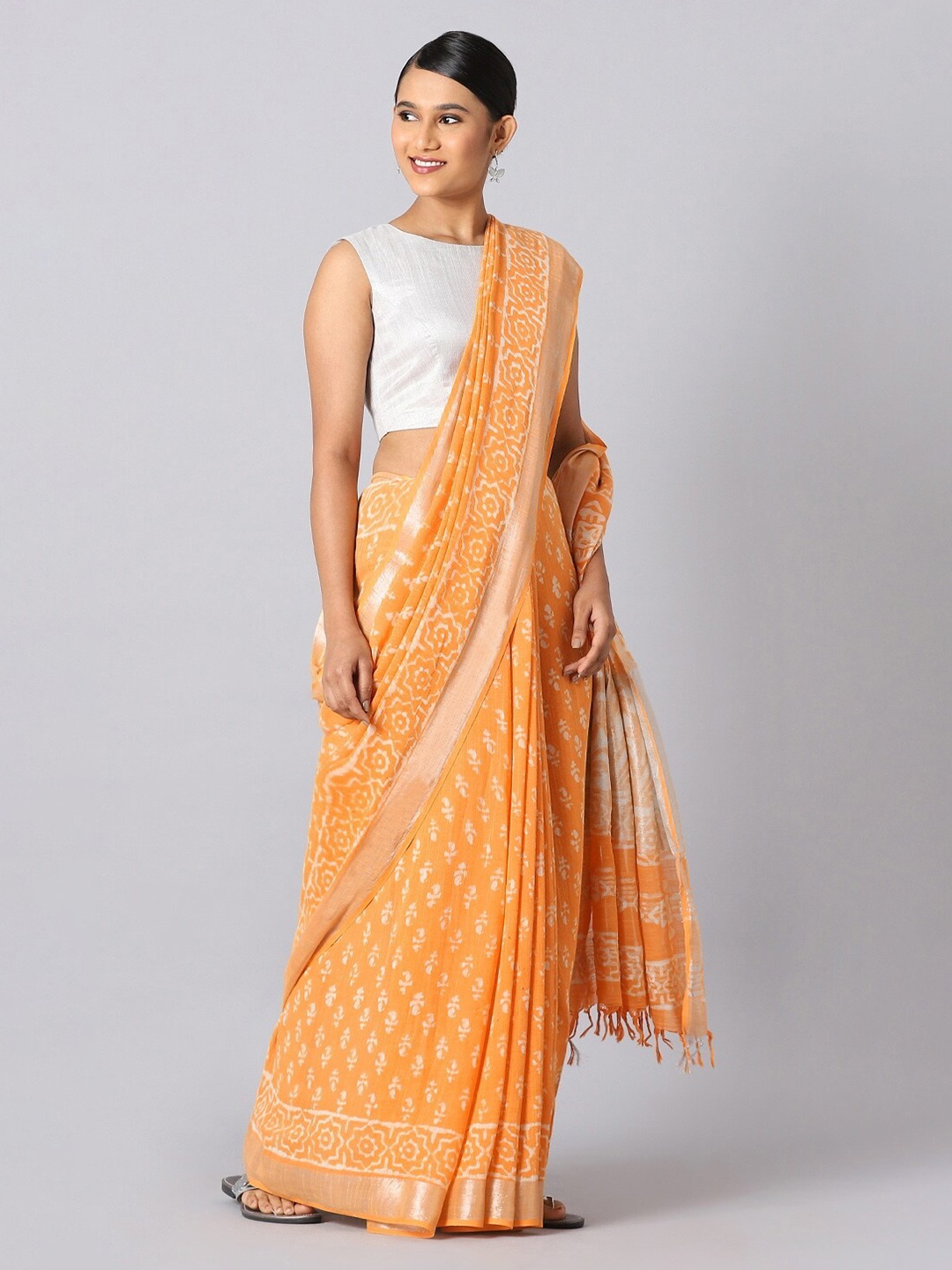 

Taneira Orange & White Floral Zari Linen Blend Bagru Saree