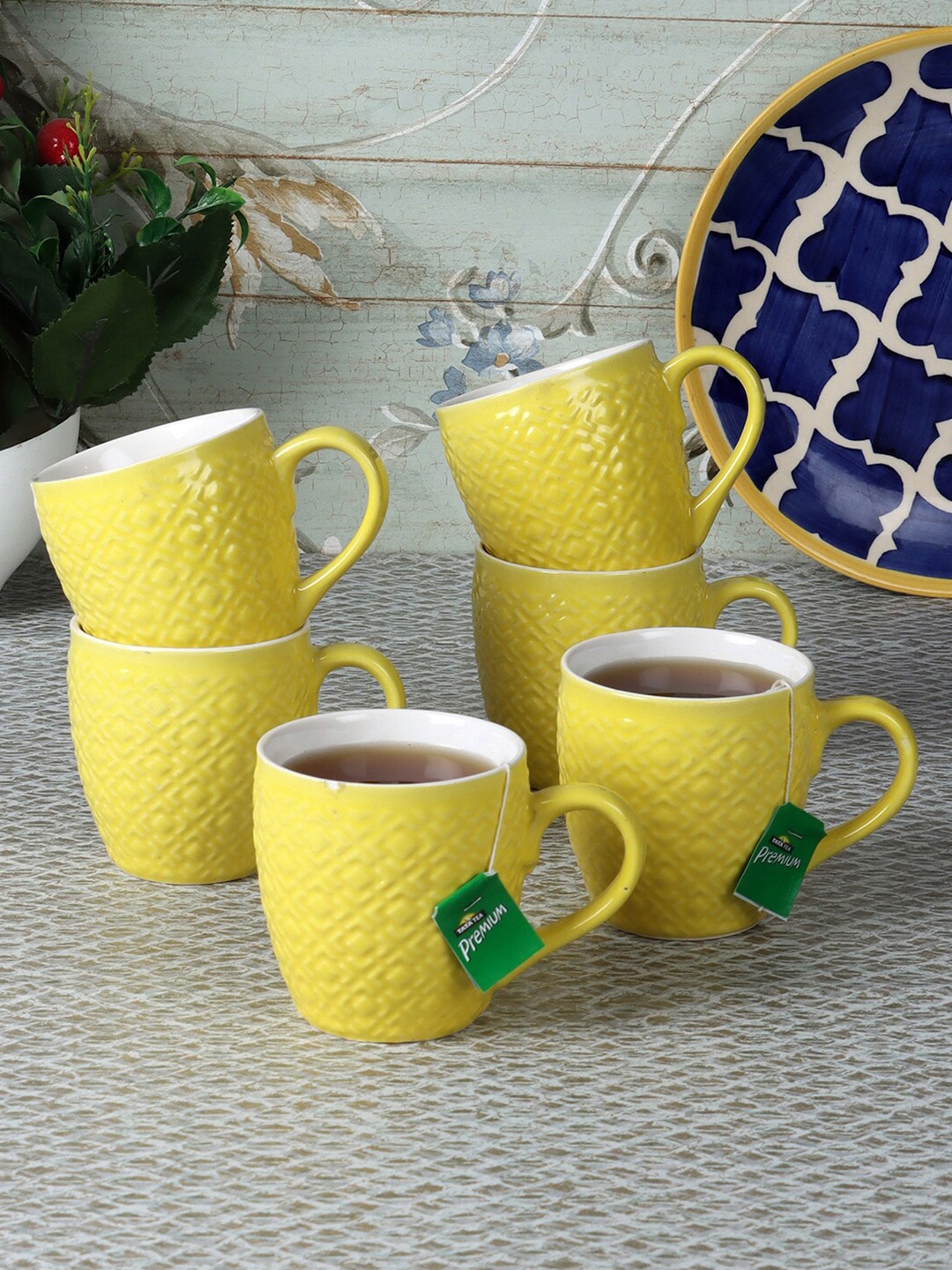

CDI Yellow & White 7 pieces Textured Ceramic Glossy Cups With Wooden Tray