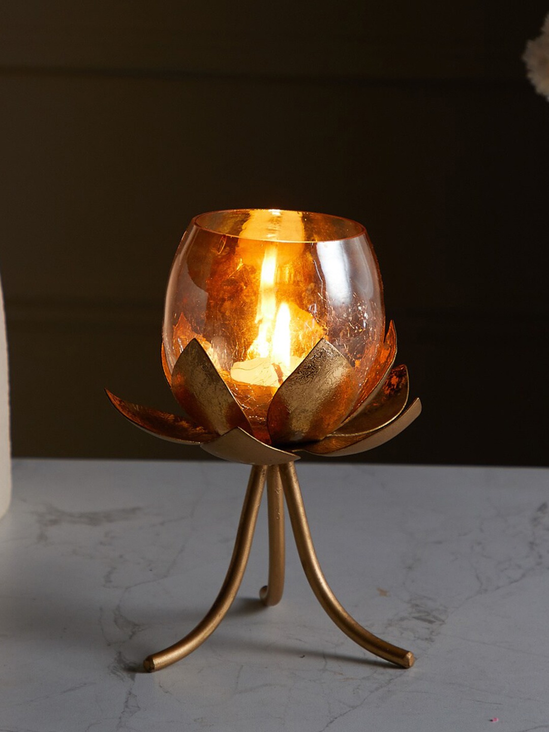 

Home Centre Gold-Toned Textured Metal Lotus-Shaped T-Light Holder