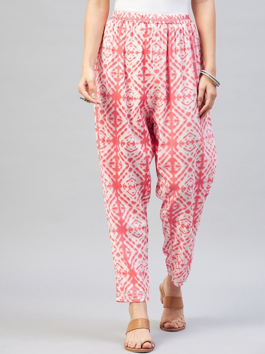 

InWeave Women Peach-Coloured Ethnic Motifs Printed Relaxed Cotton Pleated Trousers