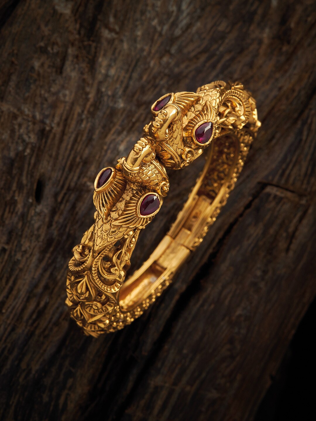 

Kushal's Fashion Jewellery Women Gold-Toned & Red Antique Kada Bracelet