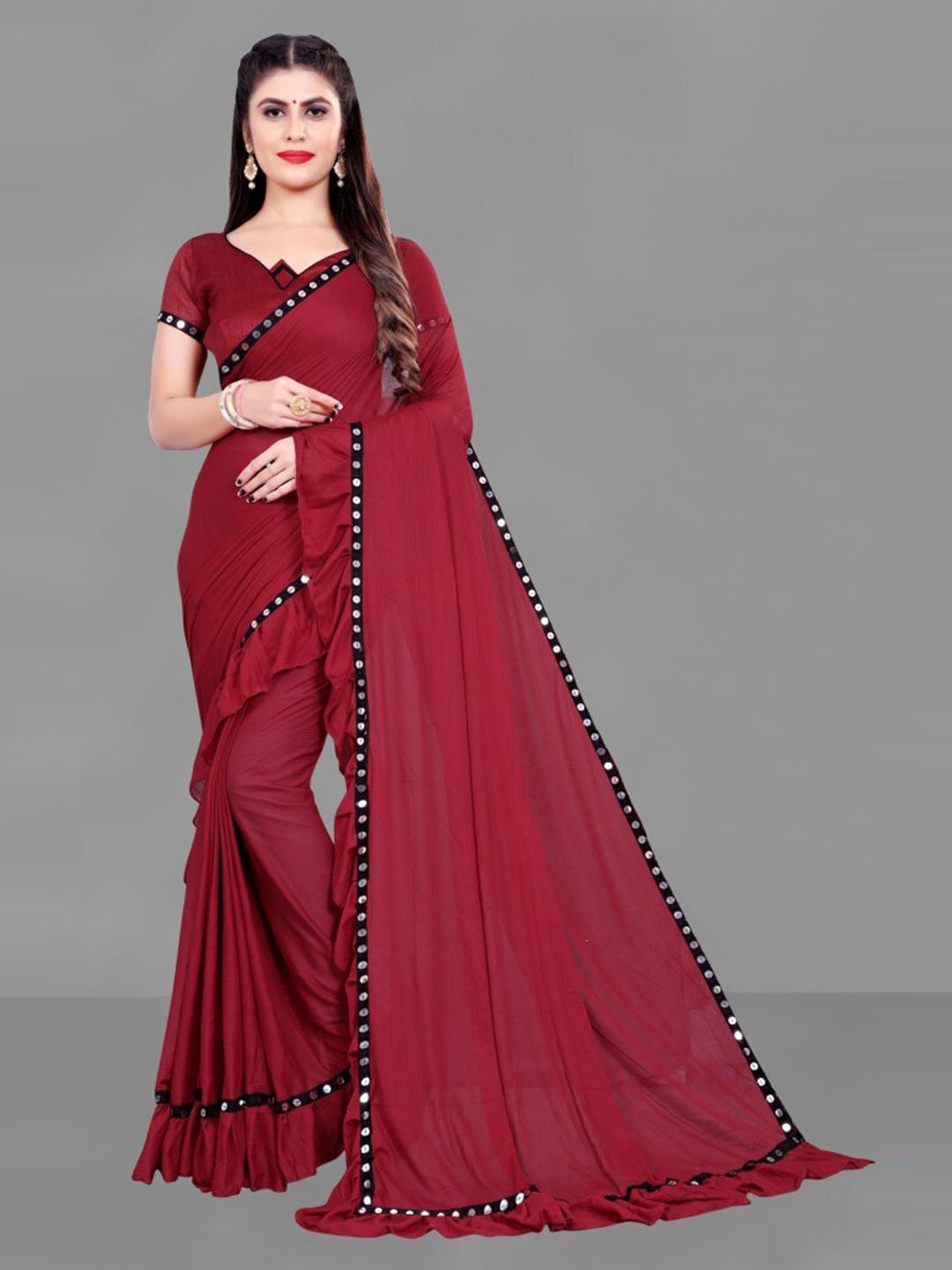 

Clomita Maroon Solid Ruffles Saree