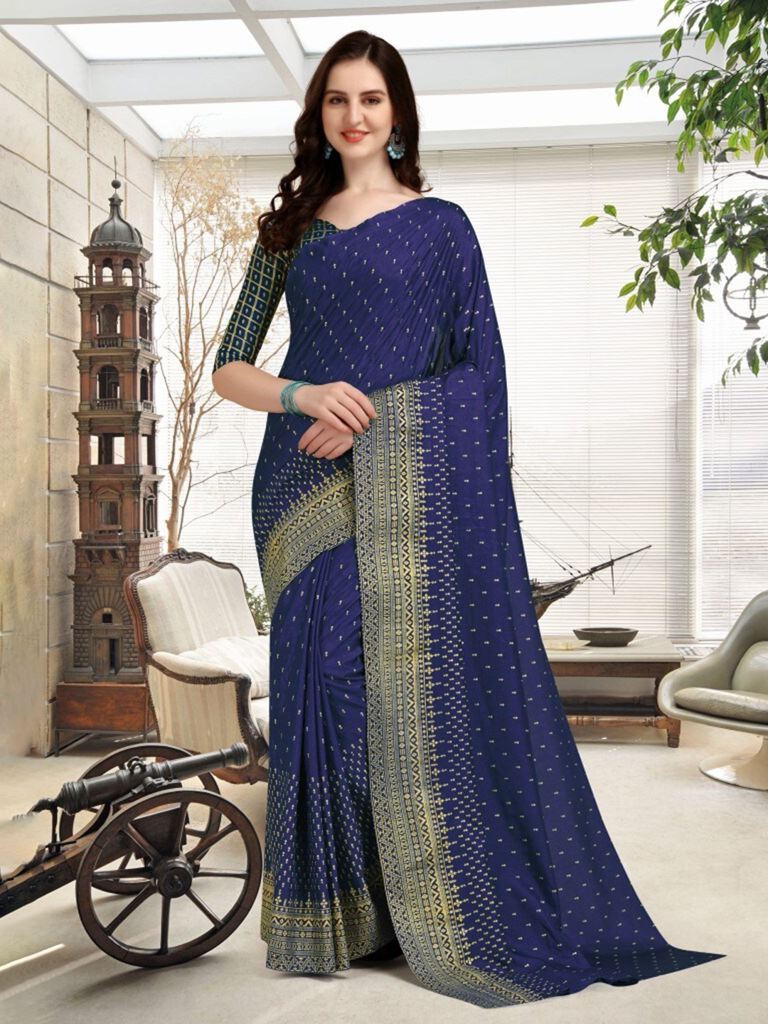 

CLOMITA Blue & Gold-Toned Ethnic Motifs Art Silk Saree