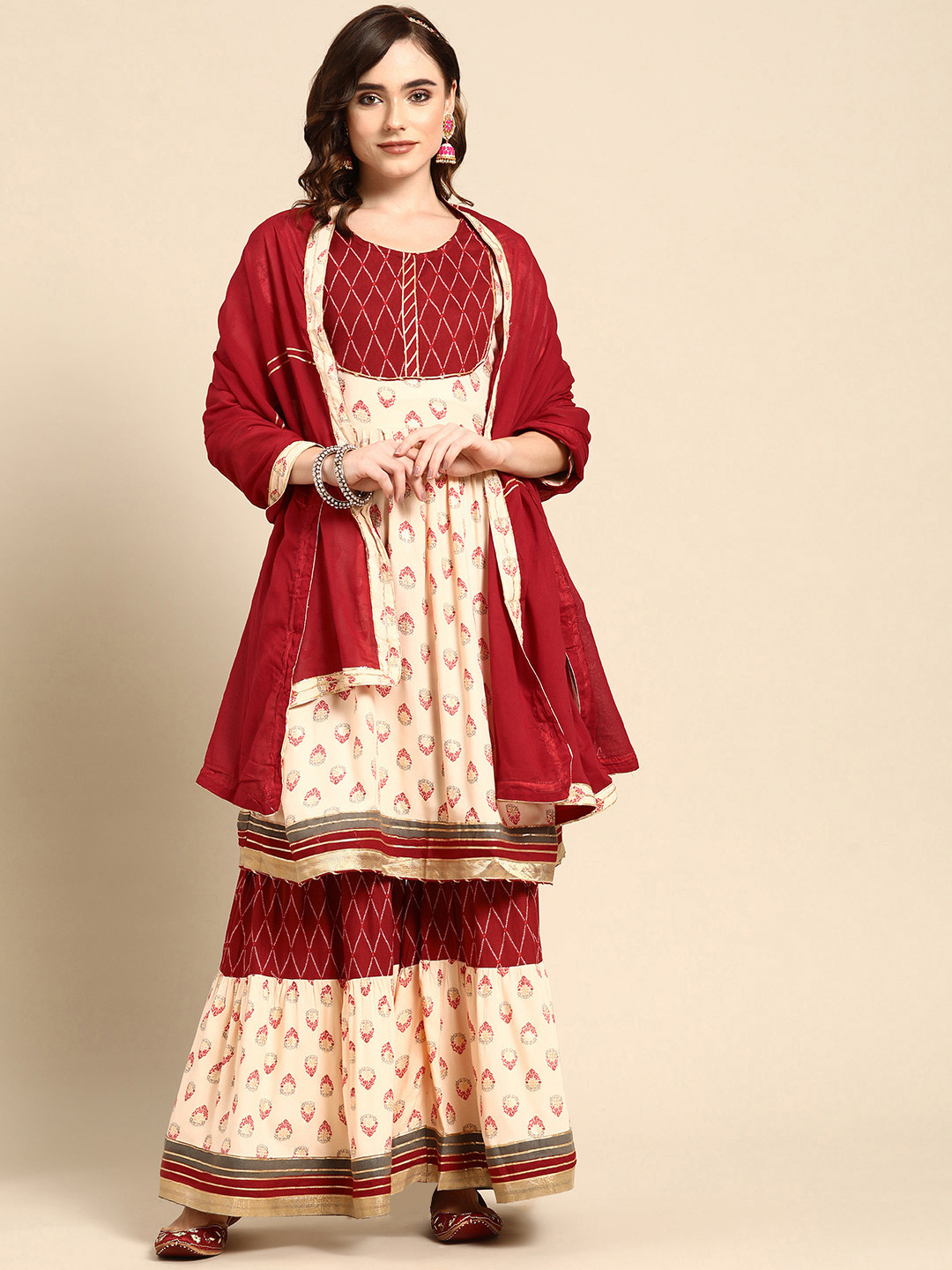 

Sangria Women Rust Ethnic Motifs Printed Gotta Patti Kurta with Sharara & With Dupatta