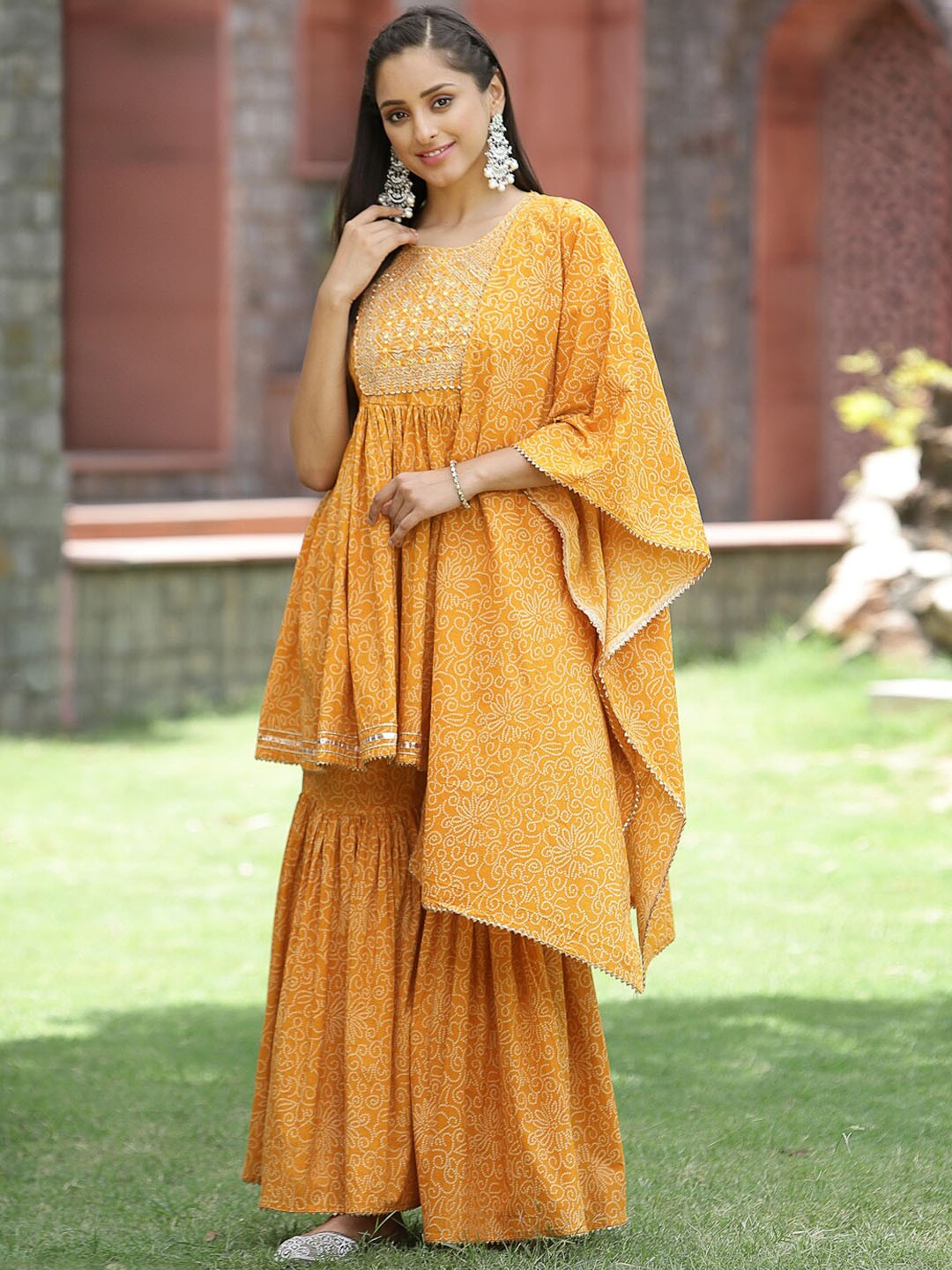 

Juniper Women Yellow Ethnic Motifs Embroidered Pleated Kurti with Sharara & With Dupatta