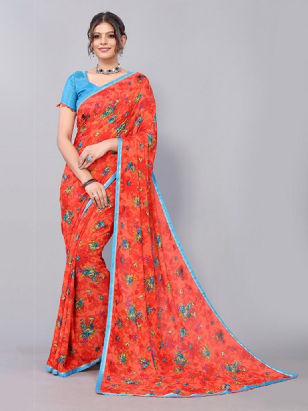 

Yashika Orange & Blue Floral Saree