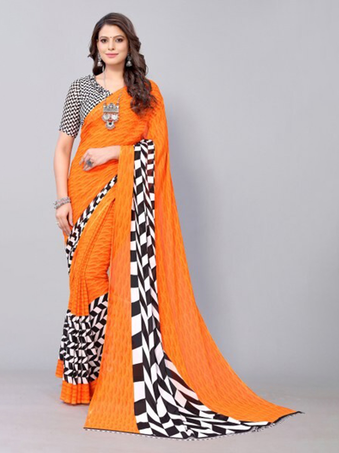 

Yashika Orange & White Saree