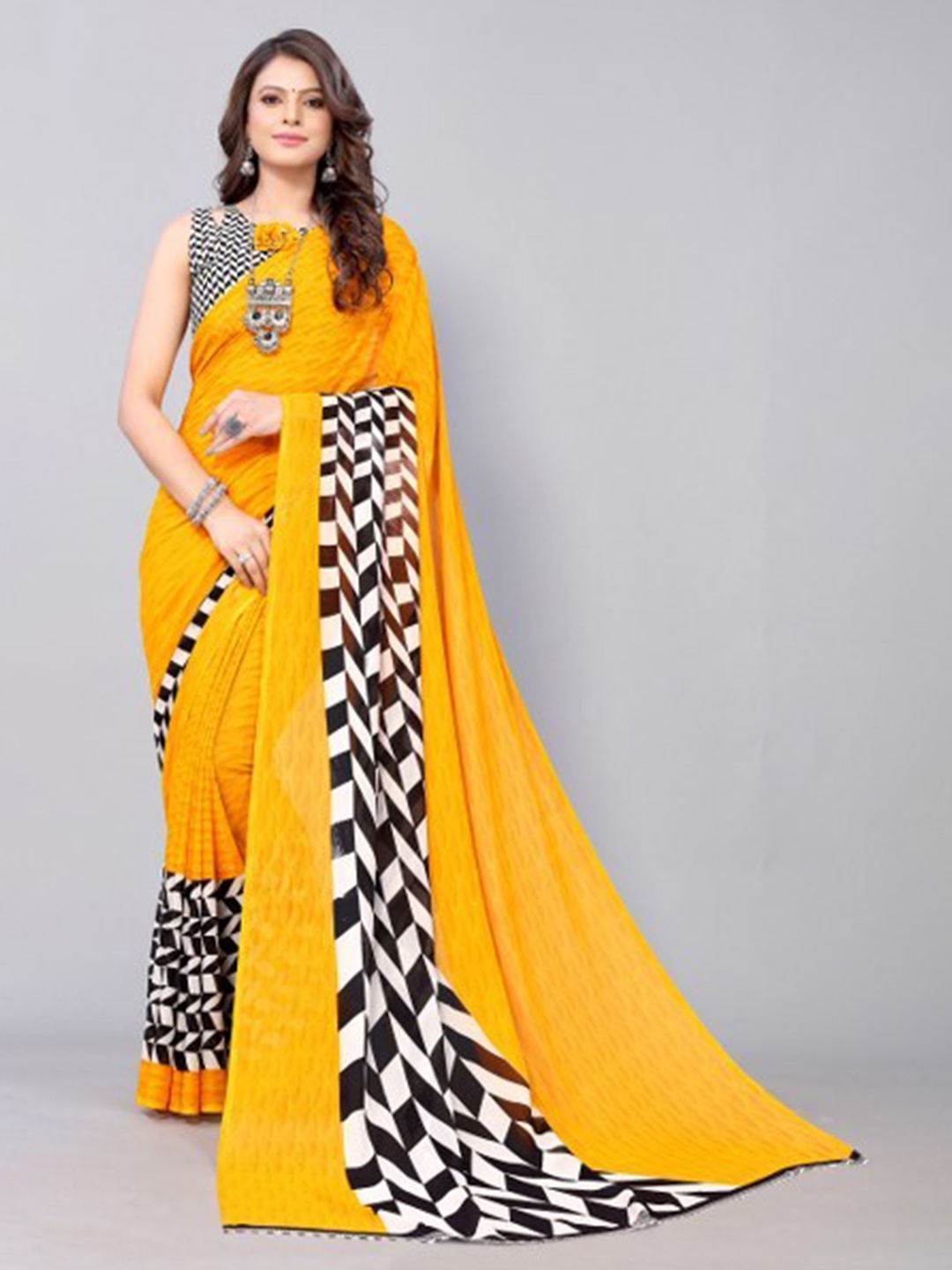 

Yashika Yellow & White Saree