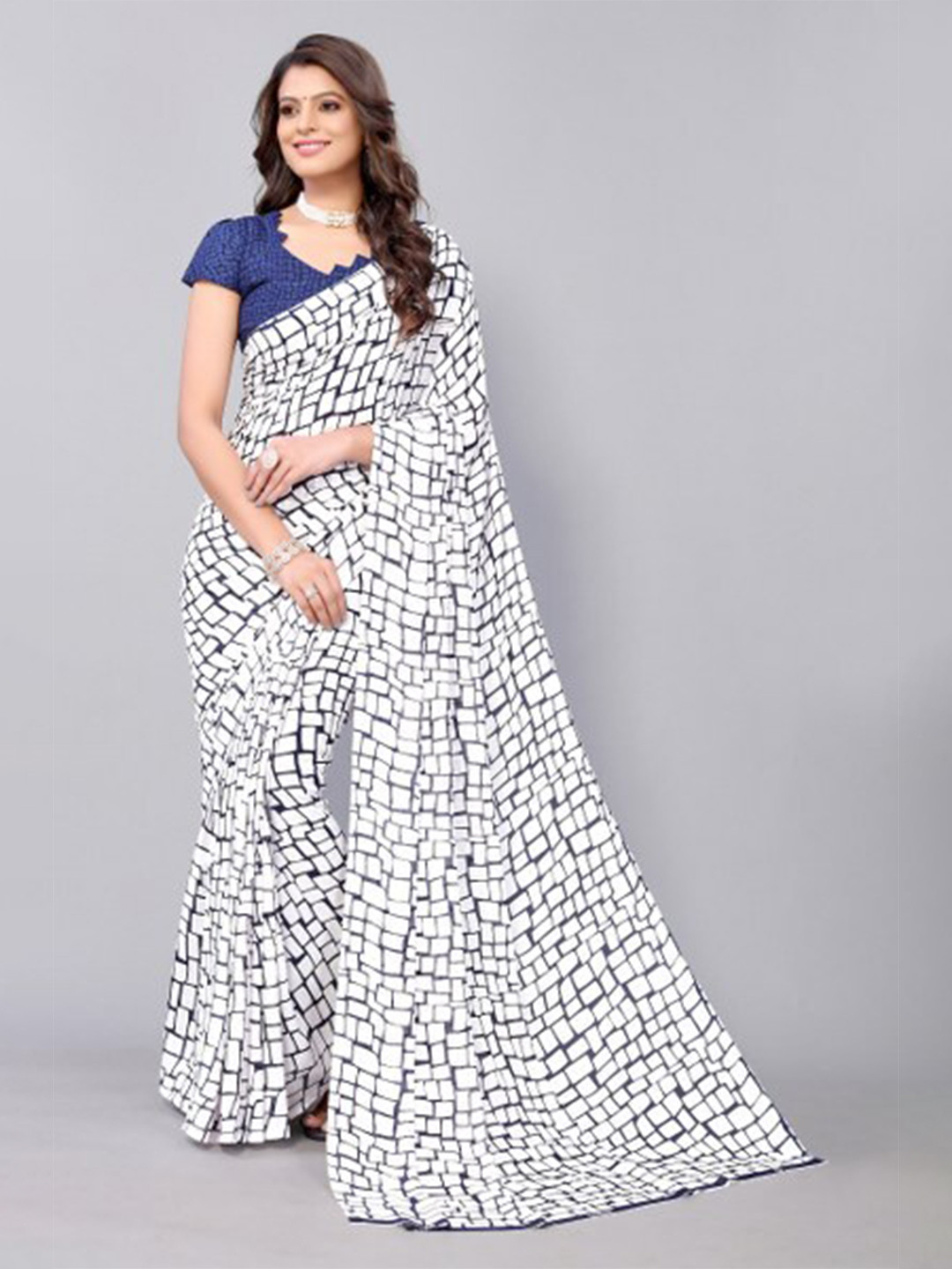 

Yashika Navy Blue & Off White Saree