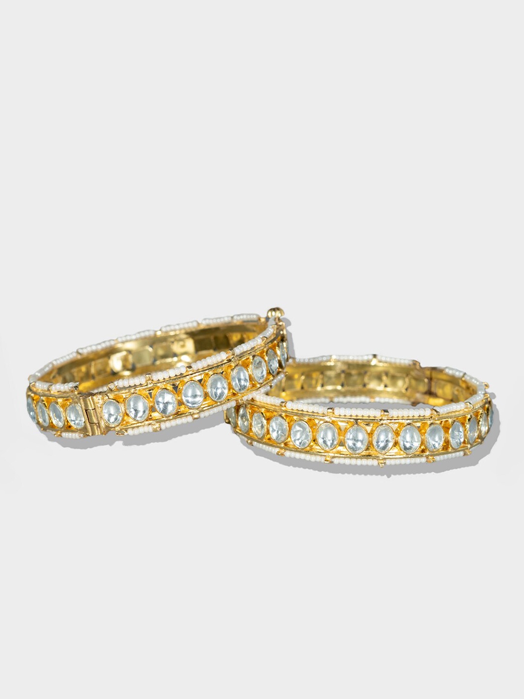 

AURAA TRENDS Set Of 2 Gold-Plated & White Kundan-Studded Bangle Set
