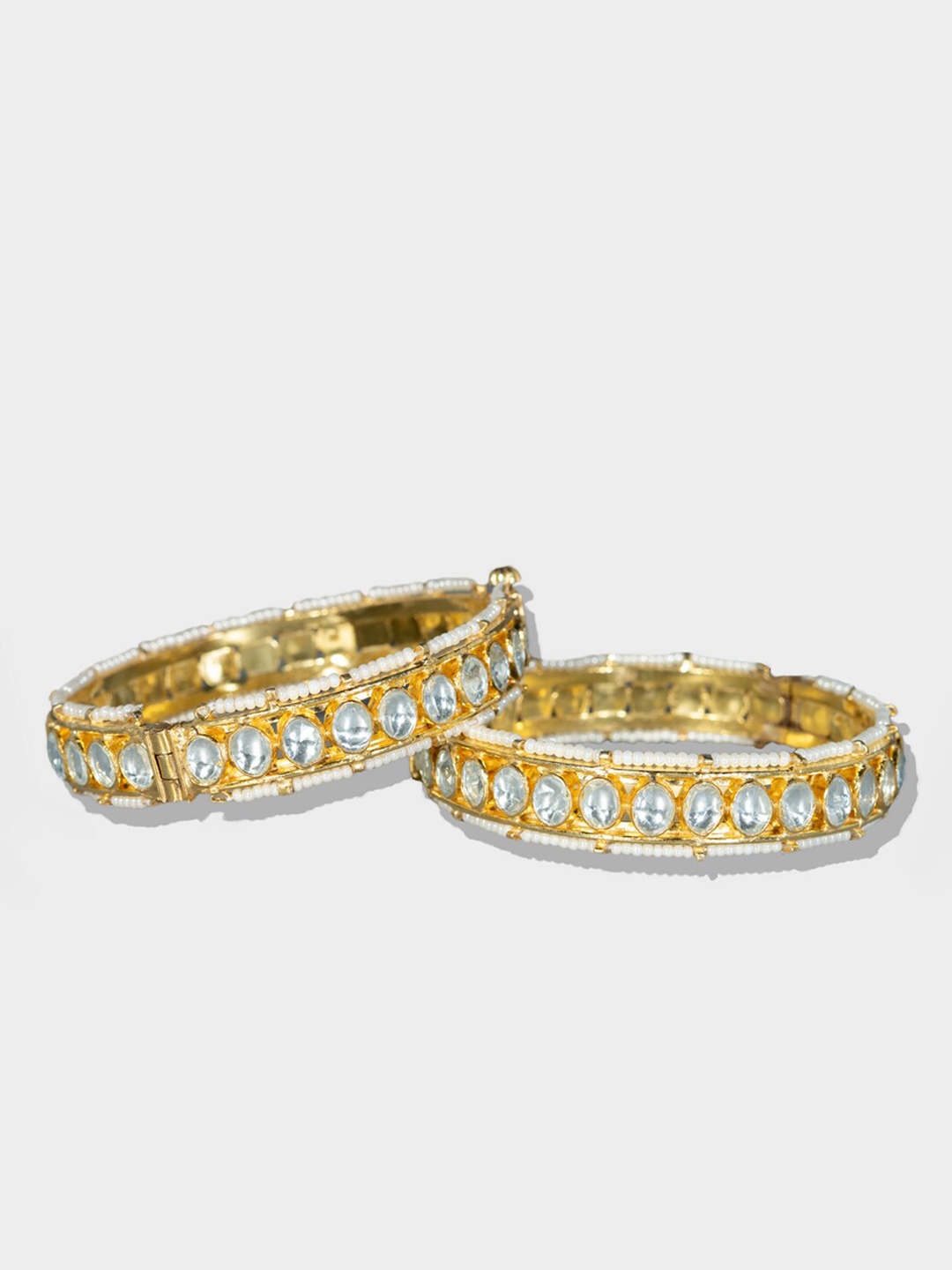 

AURAA TRENDS Set of 2 22 KT Gold-Plated White Kundan Stone-Studded Bangle