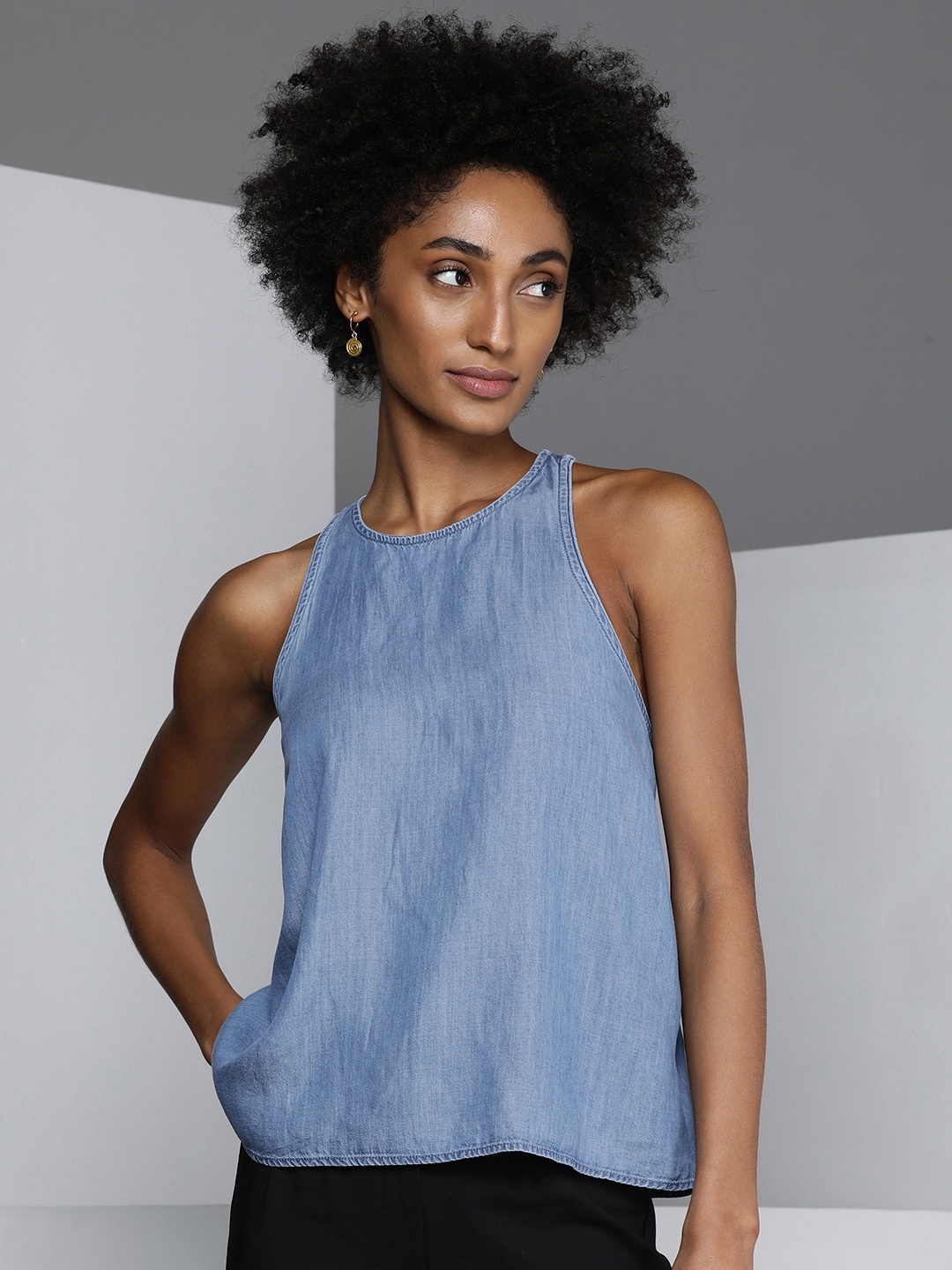 

Kenneth Cole Fluire Women Light Blue Solid Sleevless Avant Moda Top With Styled Back