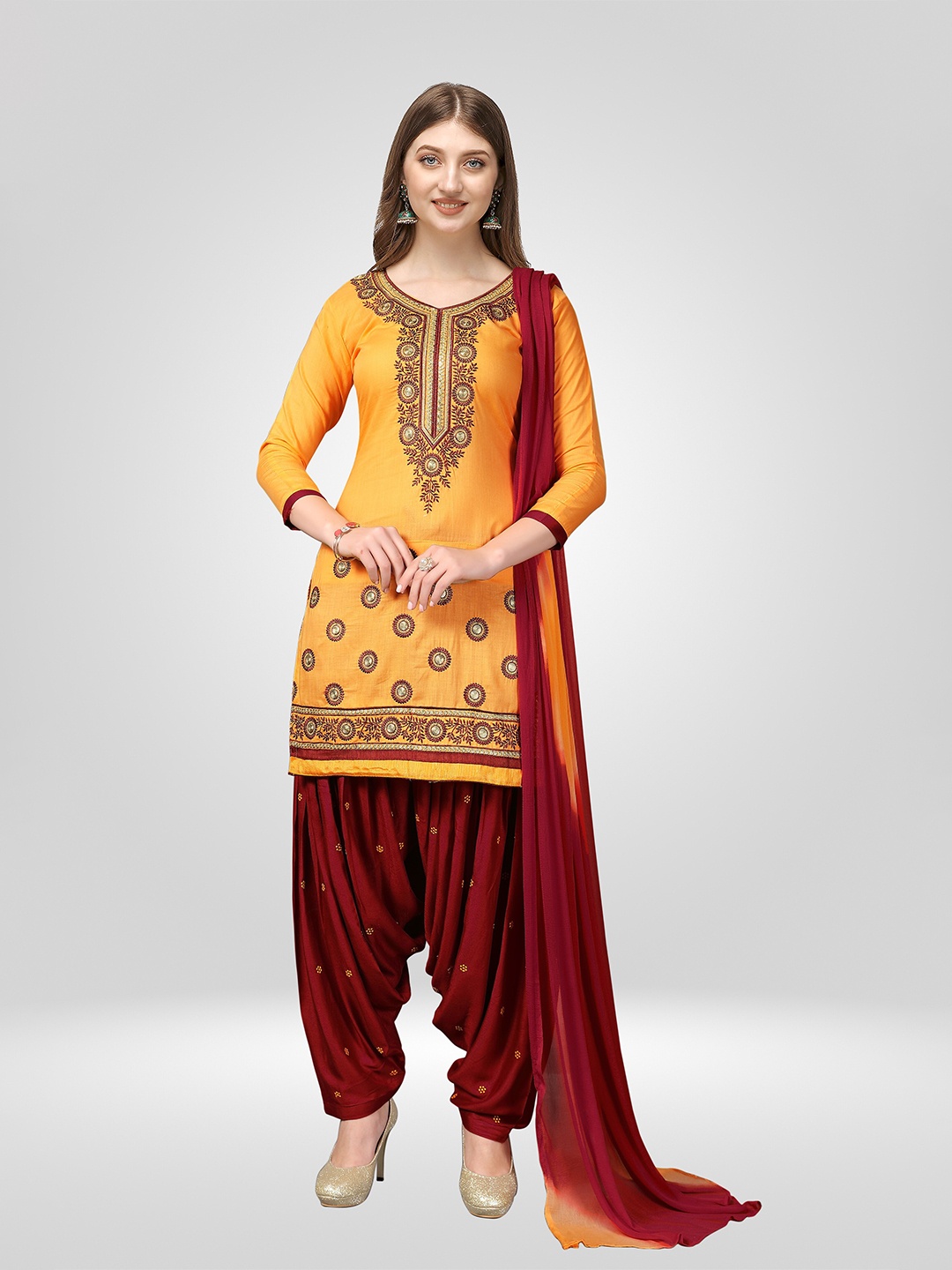 

Nivah Fashion Women Yellow & Maroon Embroidered Pure Cotton Unstitched Dress Material