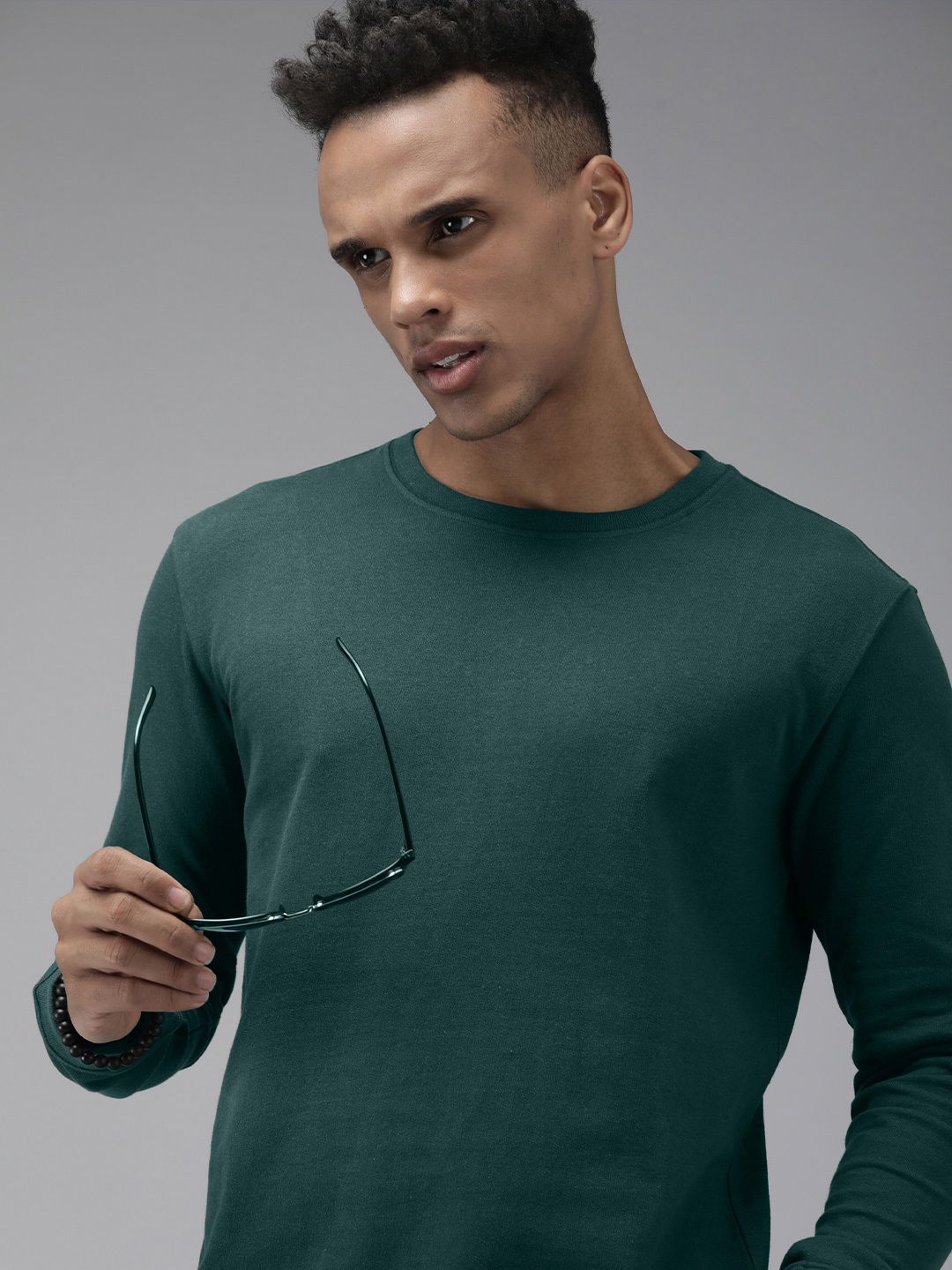 

Roadster Men Solid Sweatshirt, Green