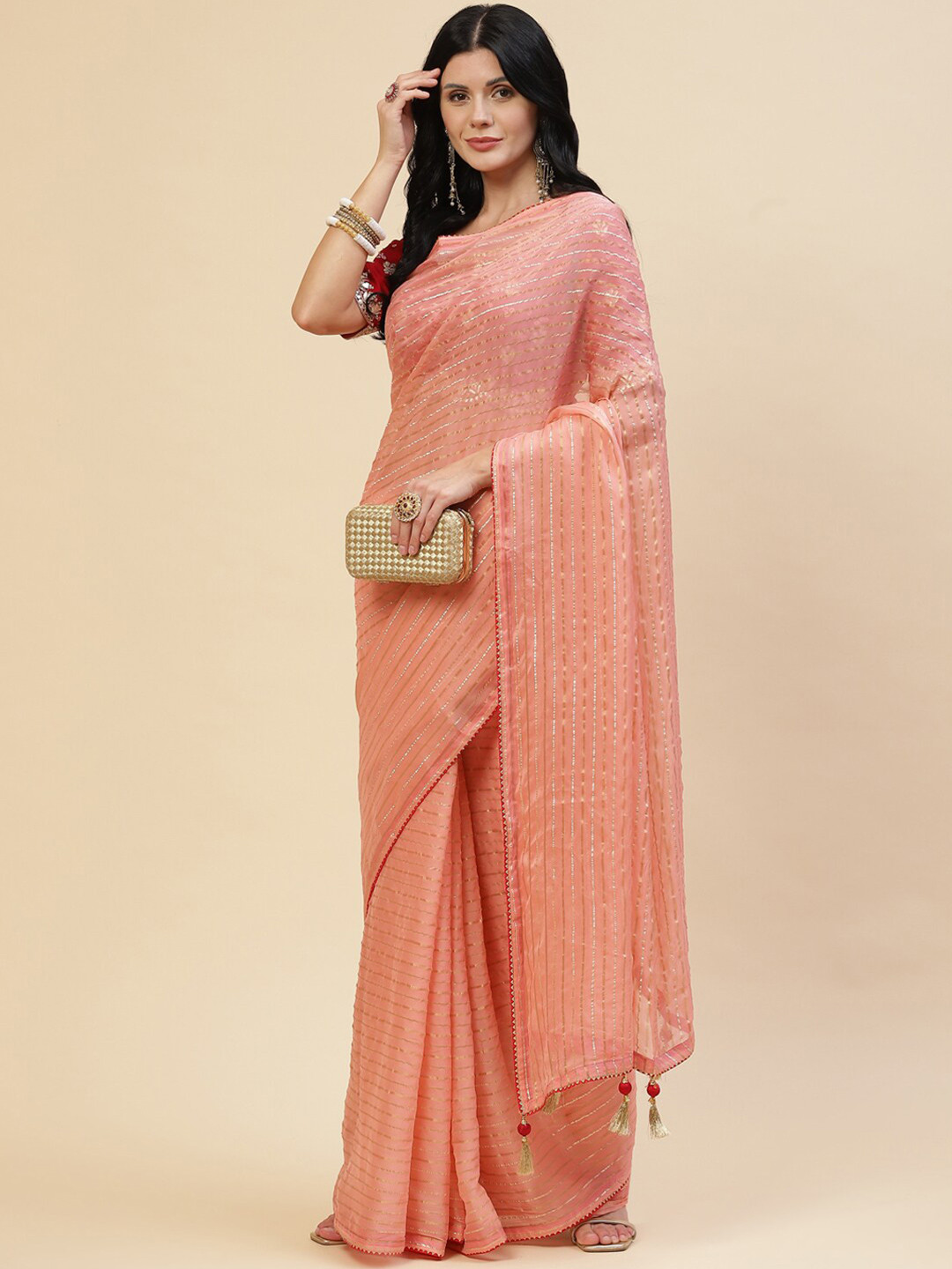 

Meena Bazaar Women Peach & Red Striped Zari Organza Saree