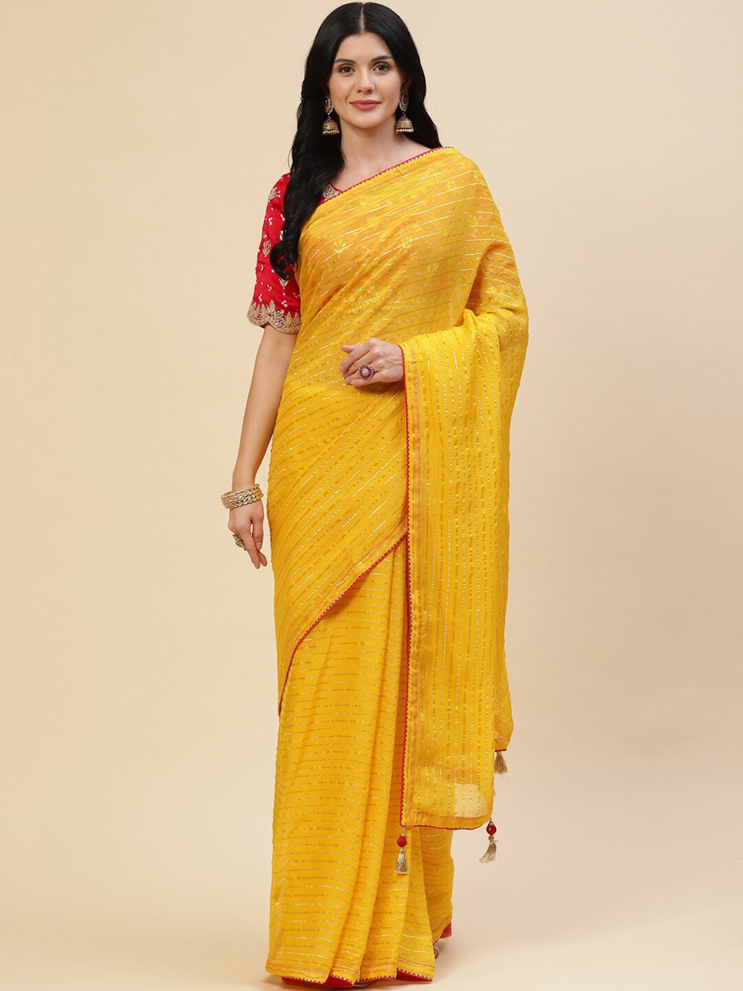 

Meena Bazaar Yellow & Gold-Toned Embellished Organza Saree