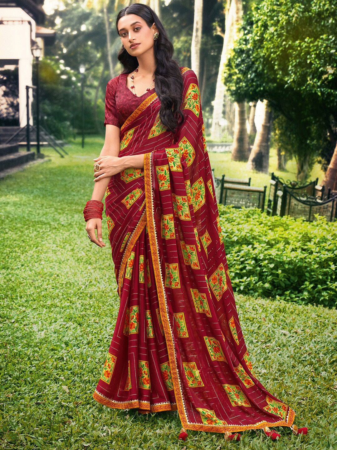 

Saree mall Maroon Yellow Floral Poly Chiffon Sarees