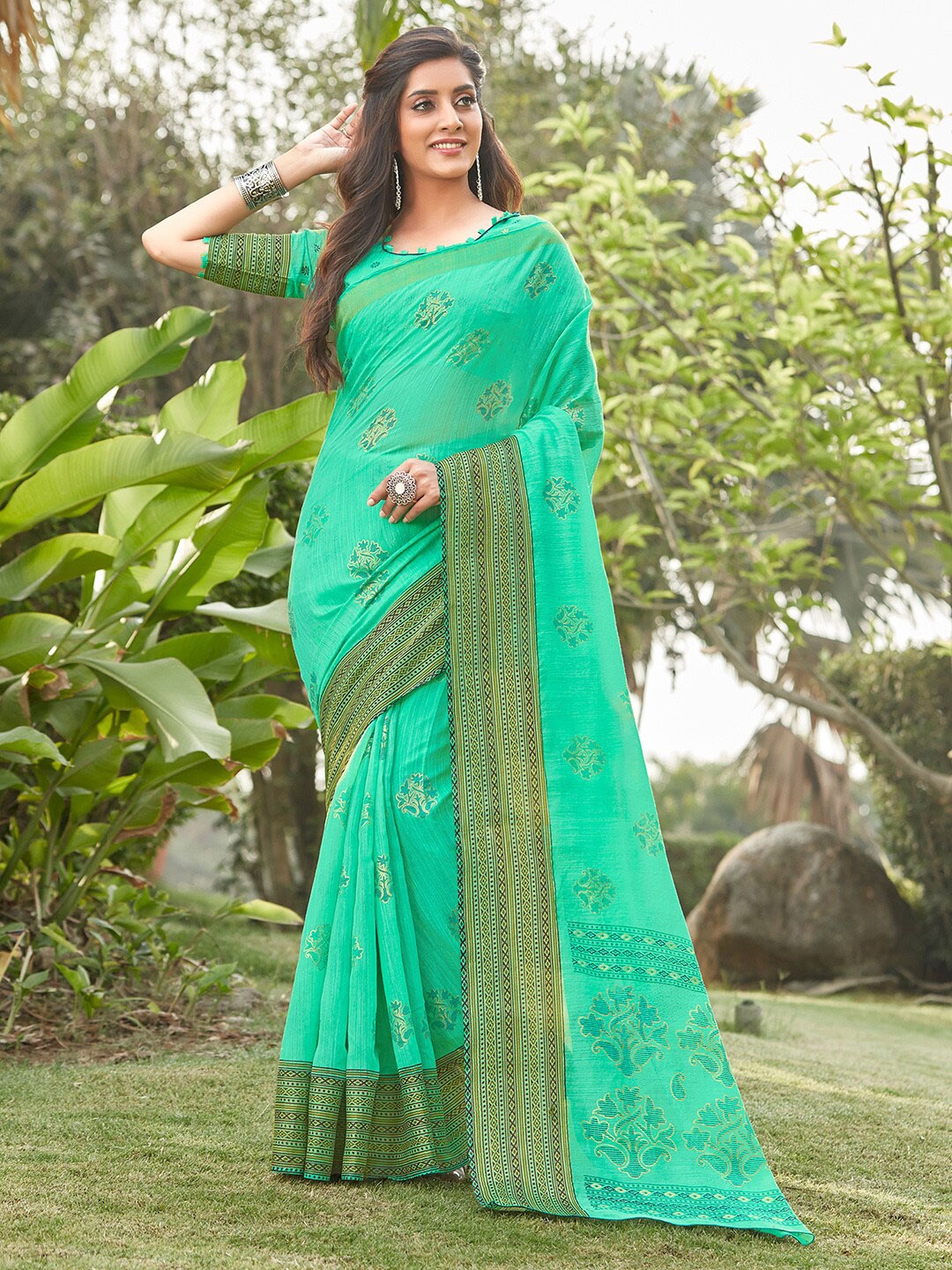 

Mitera Sea Green Ethnic Motifs Printed Linen Blend Block Print Saree With Matching Blouse