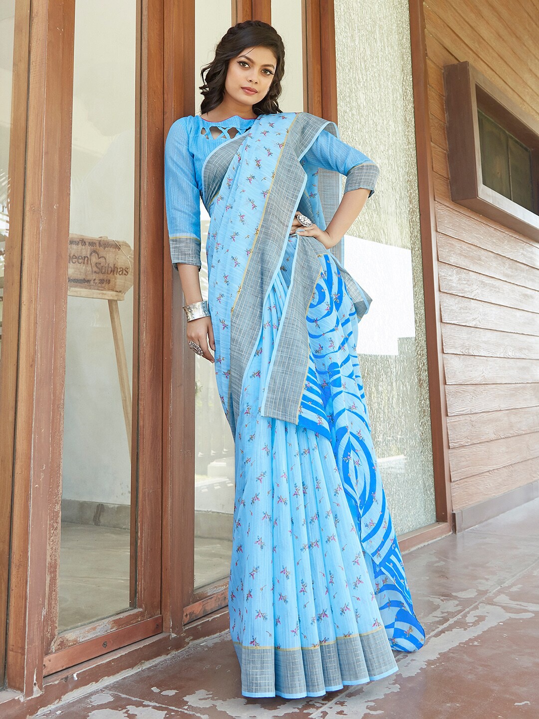 

Mitera Women Blue & Pink Floral Linen Blend Chanderi Saree With Matching Blouse