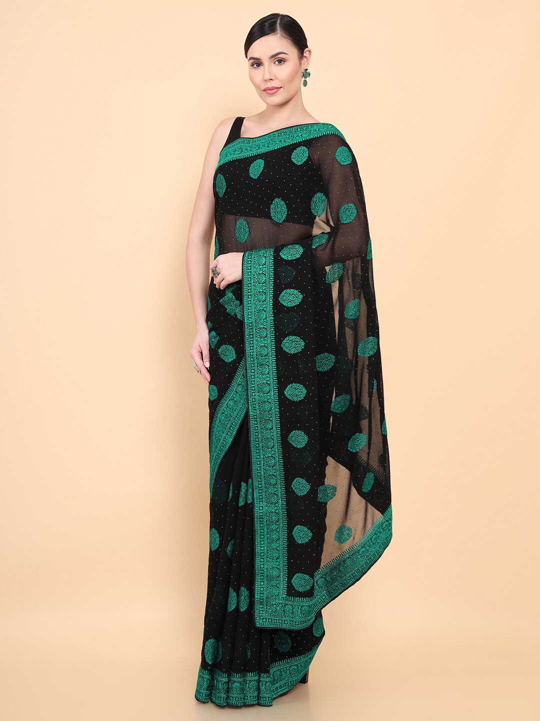 

Soch Black & Green Ethnic Motifs Saree