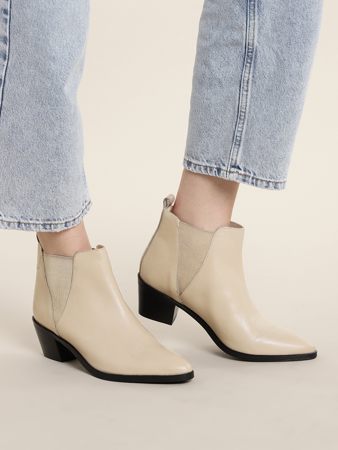 

Nautica Women Solid Mid-Top Leather Block Heel Chelsea Boots, Beige