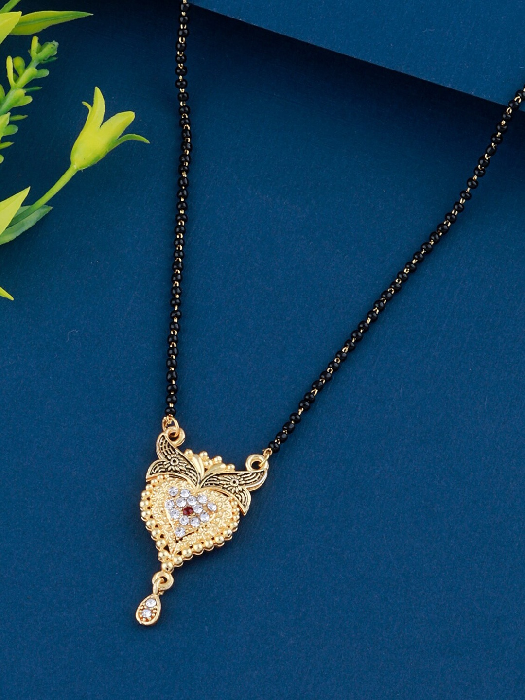 

Silver Shine Women Gold Plated Diamond Studded Mangalsutra