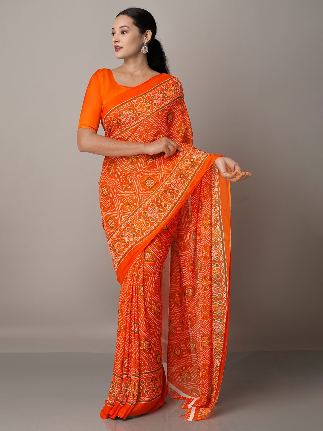 

Unnati Silks Orange & White Bandhani Saree