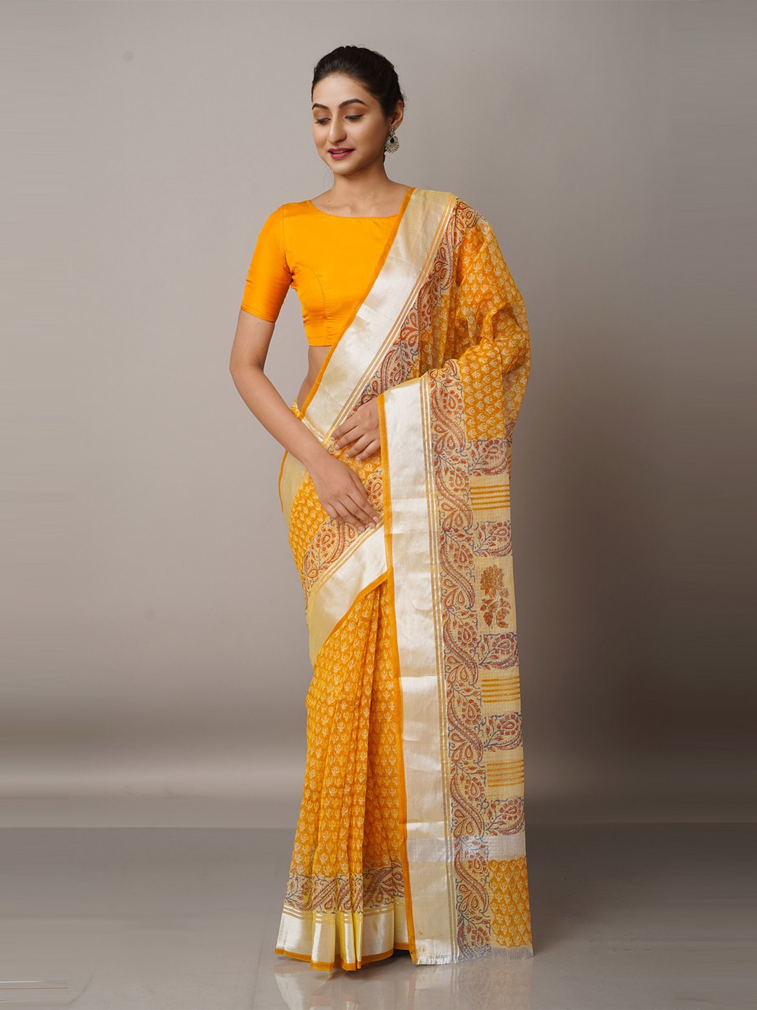 

Unnati Silks Yellow & Silver-Toned Ethnic Motifs Zari Pure Cotton Kota Saree