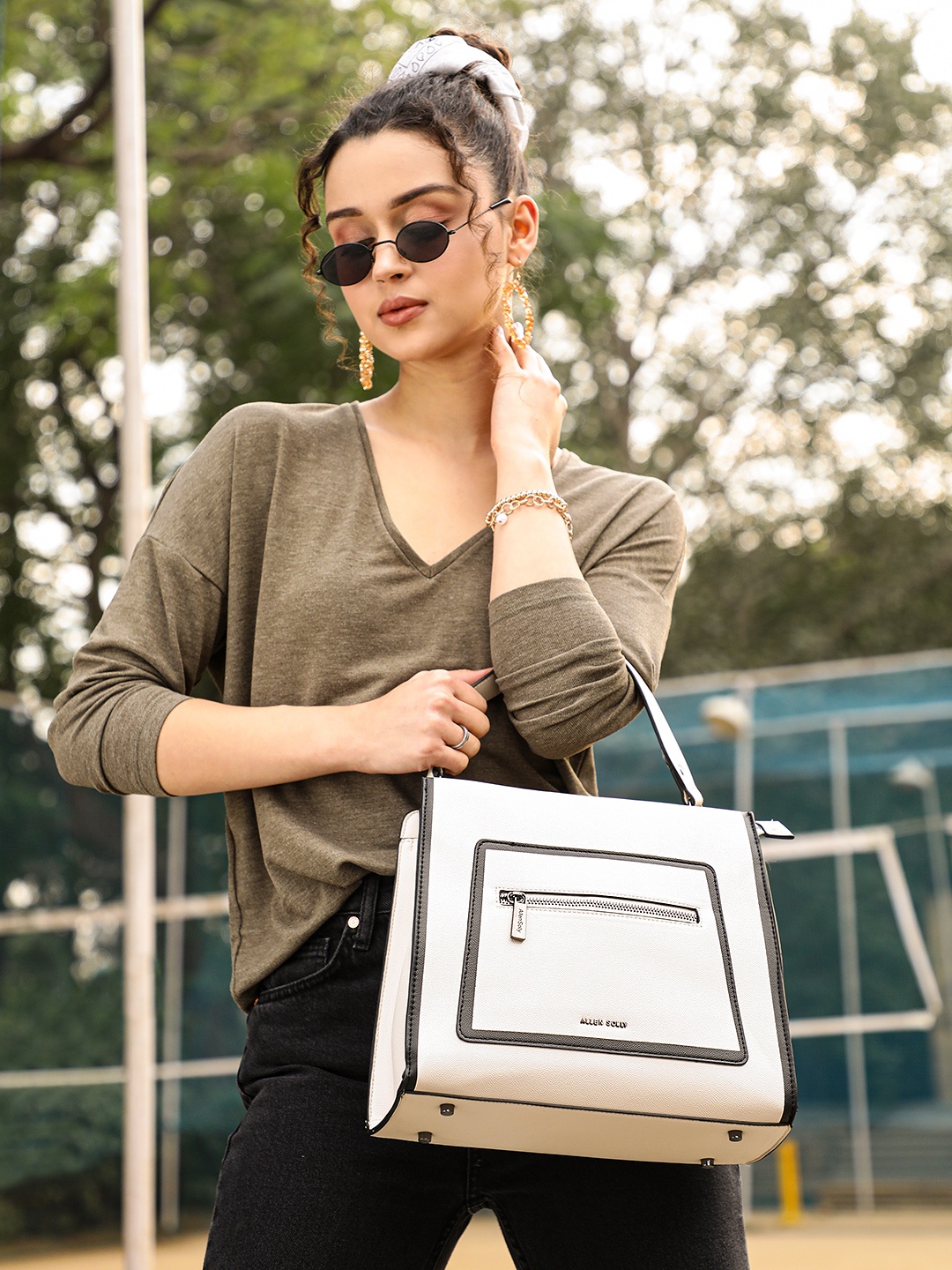 

Allen Solly Off White Solid Handheld Bag