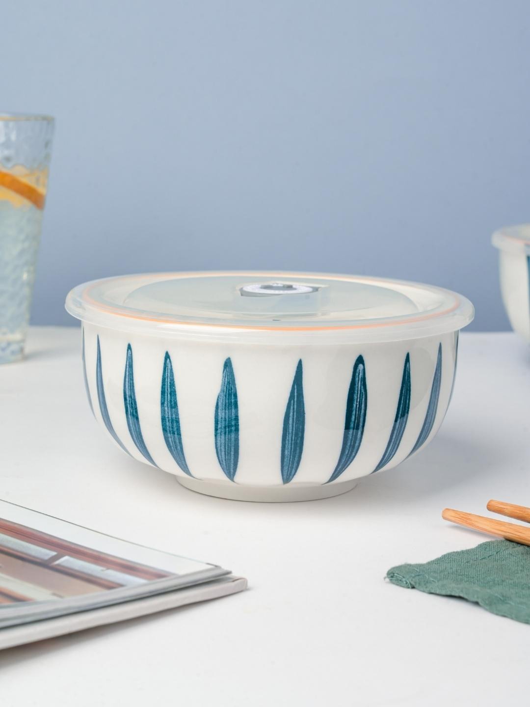 

Nestasia White & Blue Microwave safe Printed Ceramic Glossy Bowl With Lid 800 ml
