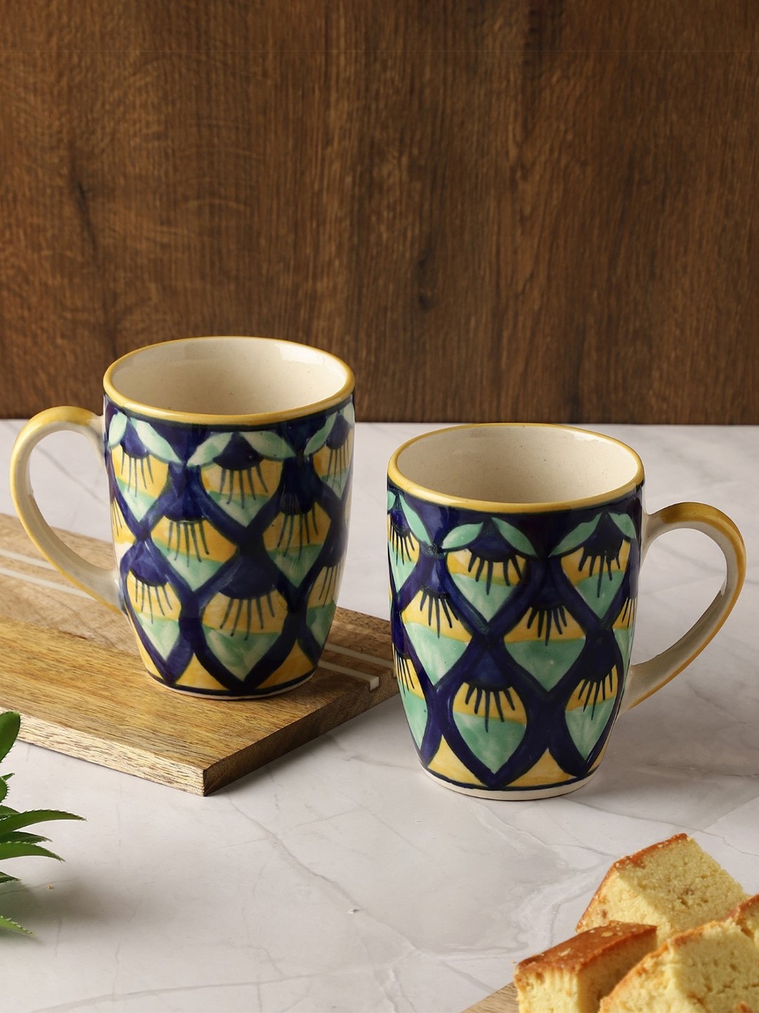 

The Decor Mart Navy Blue & Yellow Set of 2 Printed Ceramic Glossy Mugs 270 ml Each