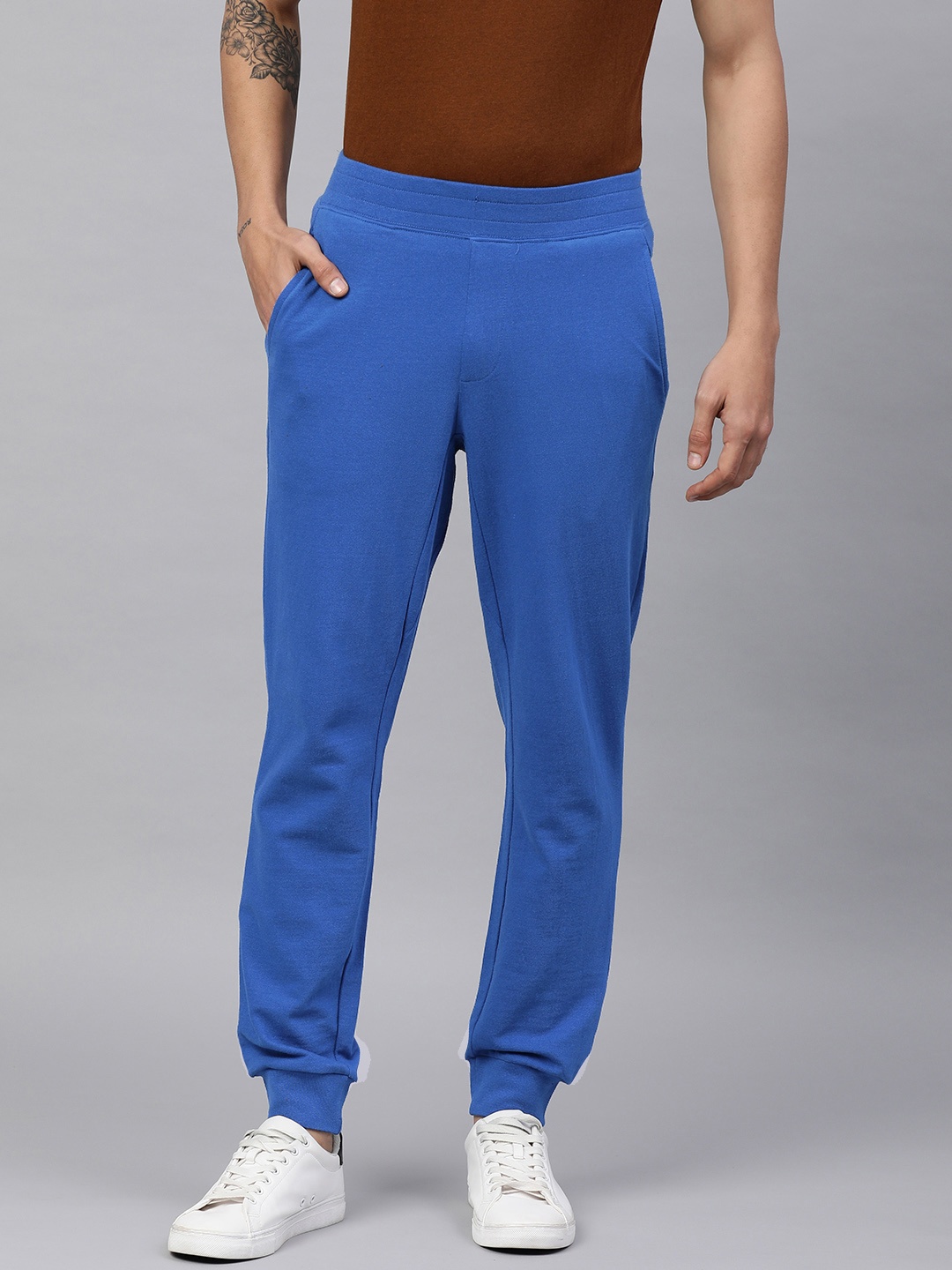 

Huetrap Men Solid Joggers, Blue