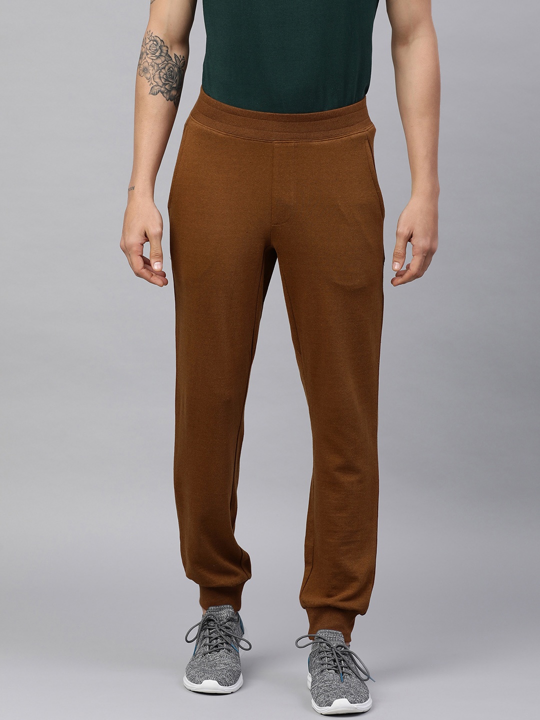 

Huetrap Men Solid Joggers, Brown