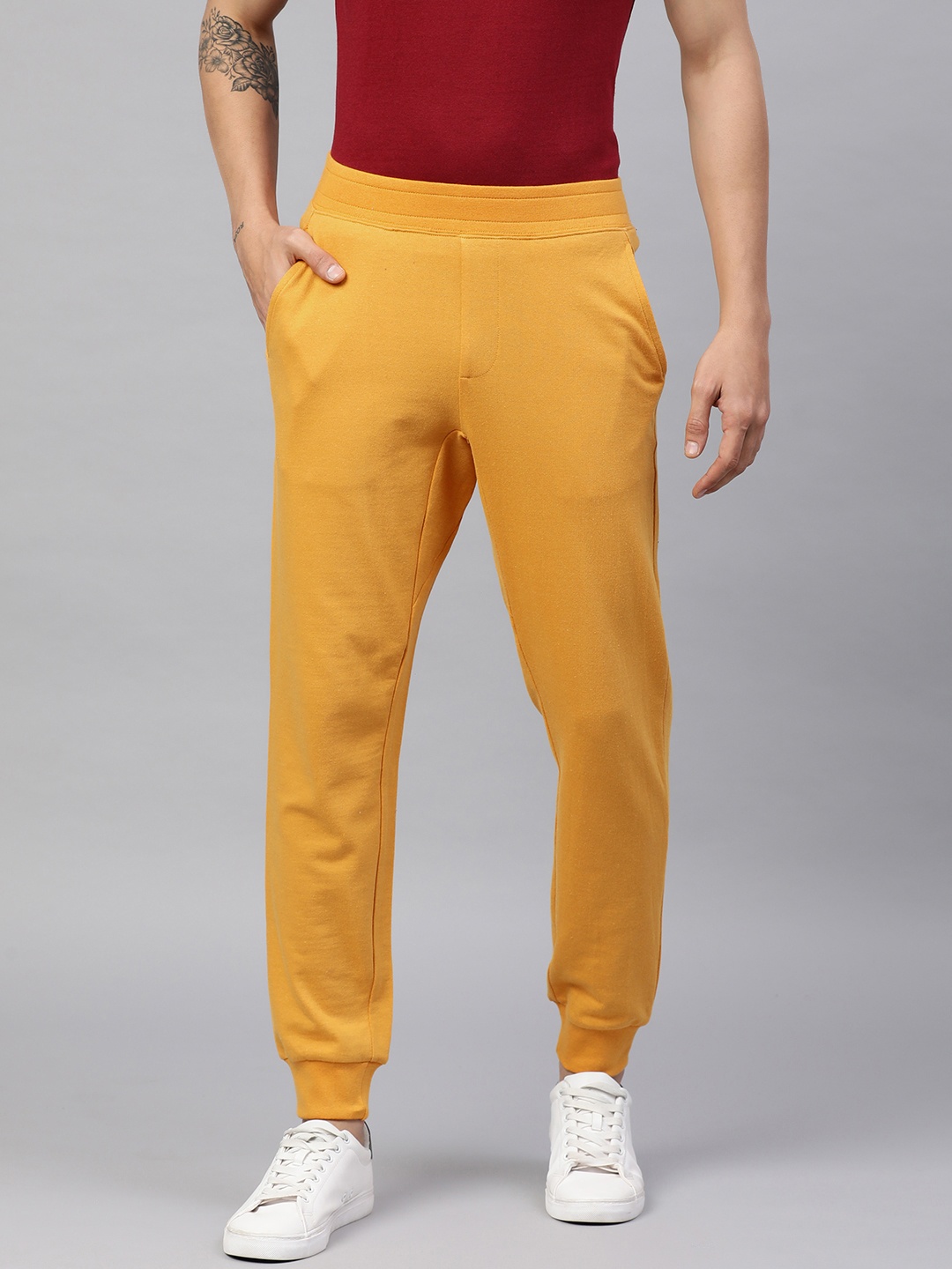 

Huetrap Men Mustard Yellow Solid Joggers