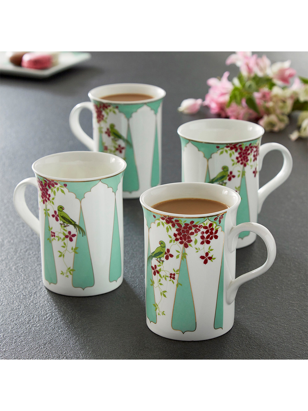 

Home Centre White Set Of 4 Printed Dishwasher safe Bone China Glossy Mugs 310ml each