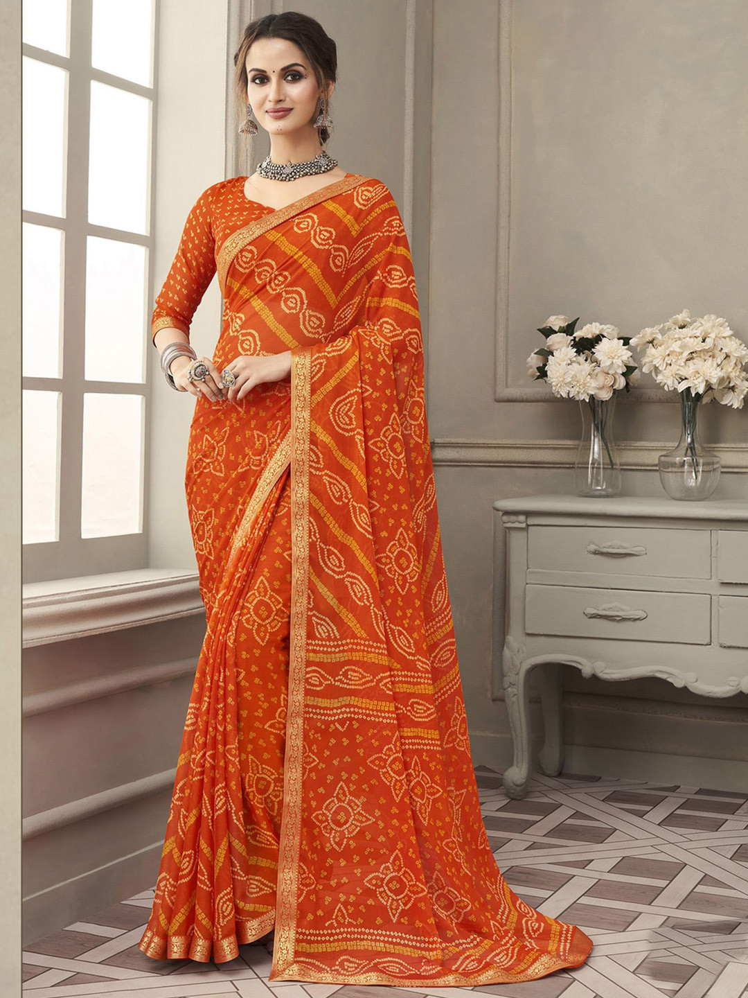 

Satrani Orange & Silver-Toned Bandhani Zari Bandhani Saree