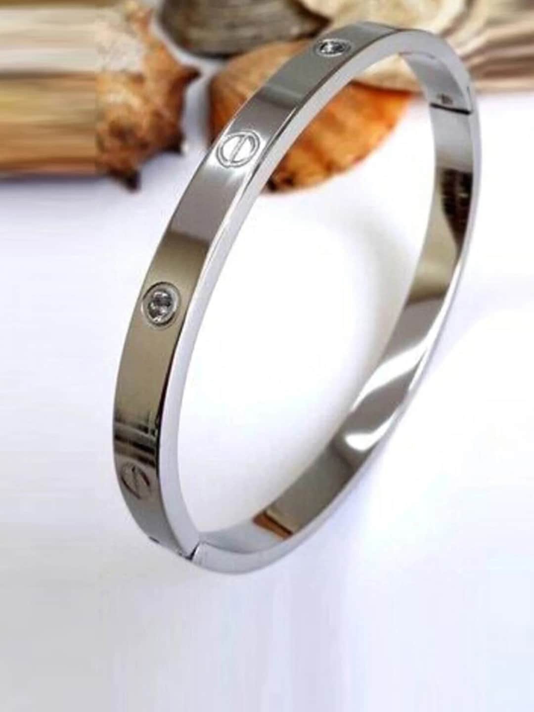

Designs By Jewels Galaxy Women Silver-Toned American Diamond Silver-Plated Bangle-Style Bracelet
