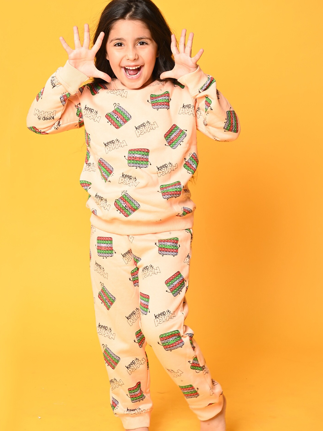 

Anthrilo Girls Peach-Coloured & Green Pop It Printed Fleece Sweatshirt With Joggers